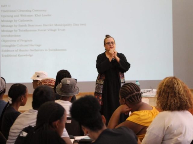 Lady speaking in a conference