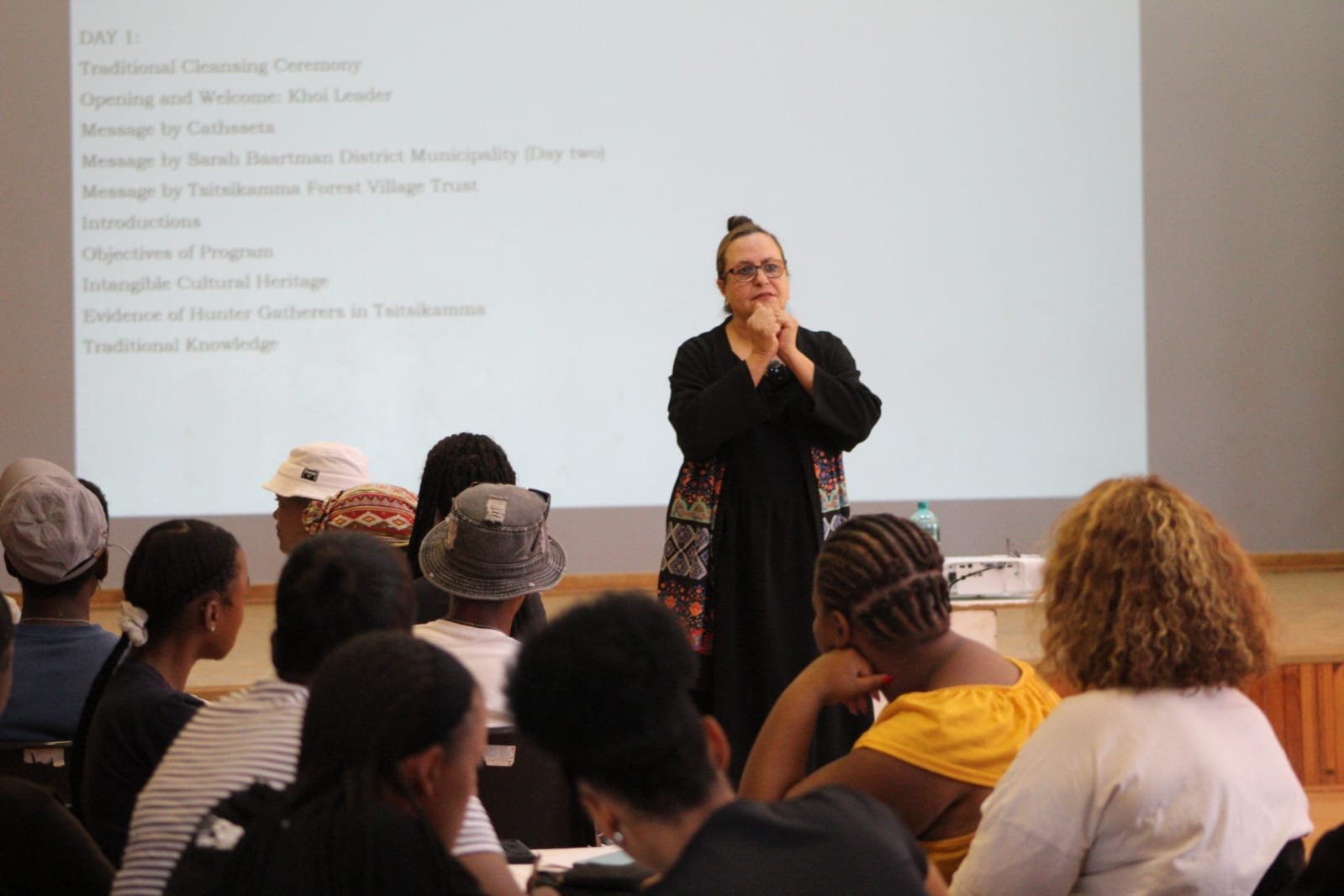 Lady speaking in a conference