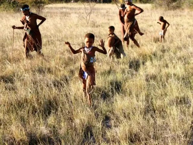 Hunter Gatherers walking in a field