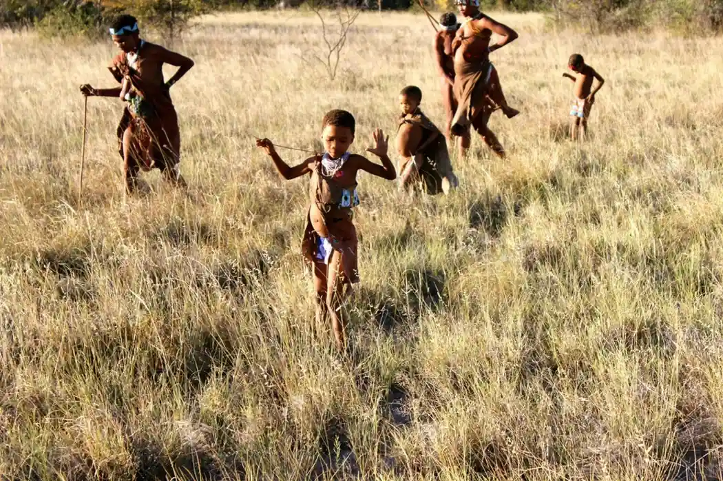 Hunter Gatherers walking in a field